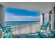 Balcony with ocean views featuring outdoor furniture and a patterned rug at 1990 N Waccamaw Dr. # 807, Murrells Inlet, SC 29576