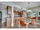 Open kitchen and dining area with bar seating, pendant lighting, and views reflected in mirrored wall at 1990 N Waccamaw Dr. # 807, Murrells Inlet, SC 29576