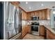 Updated kitchen featuring stainless steel appliances, granite countertops, and ample cabinet space at 1990 N Waccamaw Dr. # 807, Murrells Inlet, SC 29576