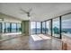 Spacious living area featuring large sliding doors to balcony with ocean views and bright natural light at 1990 N Waccamaw Dr. # 807, Murrells Inlet, SC 29576