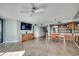 Expansive living area featuring a TV, dining space, kitchen access, and well lit at 1990 N Waccamaw Dr. # 807, Murrells Inlet, SC 29576