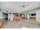 Open-concept living area with dining space, leading to a kitchen and features a large mirror wall at 1990 N Waccamaw Dr. # 807, Murrells Inlet, SC 29576