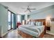 Serene main bedroom with balcony access, featuring a comfortable king-sized bed and tasteful decor at 1990 N Waccamaw Dr. # 807, Murrells Inlet, SC 29576