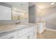 Bathroom featuring granite countertops, double sinks, tile flooring, and framed mirrors above each sink at 2004 Potomac Ct., Myrtle Beach, SC 29579