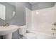 Clean bathroom features a combination tub and shower, pedestal sink, and modern fixtures at 2004 Potomac Ct., Myrtle Beach, SC 29579