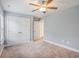 Bedroom featuring neutral walls and carpet, white trim, and a ceiling fan at 2004 Potomac Ct., Myrtle Beach, SC 29579