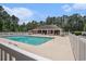 Community pool with plenty of seating, featuring a bathhouse, tables, and pristine surroundings at 2004 Potomac Ct., Myrtle Beach, SC 29579