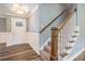 Welcoming foyer with a staircase, wood flooring, and elegant trim details at 2004 Potomac Ct., Myrtle Beach, SC 29579