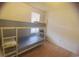 Bedroom featuring a bunk bed, hardwood floors, and a bright window at 2005 Greens Blvd. # C-204, Myrtle Beach, SC 29577