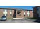 Brick two-story condo building featuring private balconies and ample parking at 2005 Greens Blvd. # C-204, Myrtle Beach, SC 29577