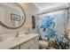 This bathroom includes a vanity and tub with ocean-themed shower curtain at 2020 Willow Run Dr. # D, Little River, SC 29566