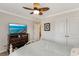 This lovely bedroom includes a TV, closet space, and decorative ceiling fan at 2020 Willow Run Dr. # D, Little River, SC 29566