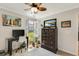 This bedroom features a computer desk, wall art, and dresser with TV at 2020 Willow Run Dr. # D, Little River, SC 29566
