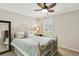 This charming bedroom features a ceiling fan and bright, natural light from the window at 2020 Willow Run Dr. # D, Little River, SC 29566