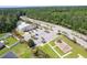 An aerial view showcases the community's amenities, including a pool, playground, and lush landscaping at 2020 Willow Run Dr. # D, Little River, SC 29566