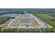 An aerial view showcases the community's proximity to a picturesque lake surrounded by lush greenery at 2020 Willow Run Dr. # D, Little River, SC 29566