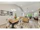 Open-concept dining area with modern decor, seamlessly connected to the living room with lots of natural light at 2020 Willow Run Dr. # D, Little River, SC 29566