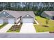 Charming townhome featuring a well-maintained lawn, landscaping, and a two-car garage at 2020 Willow Run Dr. # D, Little River, SC 29566