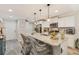 Bright kitchen with white cabinets, granite countertops, and a large island with seating for casual dining at 2020 Willow Run Dr. # D, Little River, SC 29566