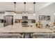 Well-lit kitchen featuring a large island, granite countertops, and stainless steel appliances at 2020 Willow Run Dr. # D, Little River, SC 29566