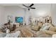 Bright living room with vaulted ceilings, entertainment center, comfortable seating, and open layout to the kitchen at 2020 Willow Run Dr. # D, Little River, SC 29566