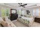 Relaxing main bedroom with tray ceilings, ceiling fan, plantation shutters, and comfortable furnishings at 2020 Willow Run Dr. # D, Little River, SC 29566