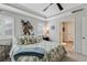 Comfortable main bedroom with tray ceilings, plantation shutters, neutral decor, and an en-suite bathroom at 2020 Willow Run Dr. # D, Little River, SC 29566