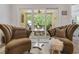 Outdoor patio area with seating and peaceful view of the backyard, accessible through sliding glass doors at 2020 Willow Run Dr. # D, Little River, SC 29566