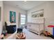 Bedroom with a white crib, chair, and art work hanging on the walls at 212 Carolina Lakes Blvd., Myrtle Beach, SC 29588