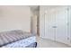 Cozy bedroom features plush carpet, neutral walls, and a closet with double doors at 212 Carolina Lakes Blvd., Myrtle Beach, SC 29588