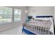 Bright bedroom featuring a large window, plush bed, and comfortable work space at 212 Carolina Lakes Blvd., Myrtle Beach, SC 29588