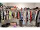 Walk-in closet filled with hanging clothes, shelves, and storage containers at 212 Carolina Lakes Blvd., Myrtle Beach, SC 29588