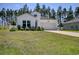 Charming single-story home with white siding, manicured lawn, and attached two-car garage at 212 Carolina Lakes Blvd., Myrtle Beach, SC 29588