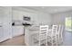 Stylish kitchen with a breakfast bar, stainless steel appliances, and plenty of natural light at 212 Carolina Lakes Blvd., Myrtle Beach, SC 29588