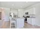 Bright kitchen features an island with seating, stainless appliances, and ample cabinet space at 212 Carolina Lakes Blvd., Myrtle Beach, SC 29588