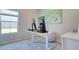 A home office featuring a large window, neutral walls, and a desk with monitors at 212 Carolina Lakes Blvd., Myrtle Beach, SC 29588
