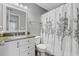 Bathroom with granite vanity and decorative shower curtain at 2265 Huntingdon Dr. # J, Surfside Beach, SC 29575