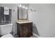 Bathroom features a brown vanity, large mirror and well lit vanity lights at 2265 Huntingdon Dr. # J, Surfside Beach, SC 29575