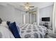 Cozy bedroom with a mirrored closet, a ceiling fan and large comfy bed at 2265 Huntingdon Dr. # J, Surfside Beach, SC 29575
