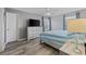 Relaxing bedroom featuring a ceiling fan, large dresser and a comfortable bed at 2265 Huntingdon Dr. # J, Surfside Beach, SC 29575