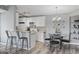Bright kitchen features white cabinets, stainless steel appliances and a dining table at 2265 Huntingdon Dr. # J, Surfside Beach, SC 29575