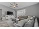 Cozy living room features recessed lighting, ceiling fan, and a plush gray sofa at 2265 Huntingdon Dr. # J, Surfside Beach, SC 29575