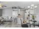 Open-concept living room and kitchen with grey walls, modern furniture, and eat in counter at 2265 Huntingdon Dr. # J, Surfside Beach, SC 29575