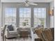 Inviting living room with three windows overlooking the front and filled with comfortable furnishings at 2265 Huntingdon Dr. # J, Surfside Beach, SC 29575
