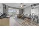 Comfortable living room has gray walls, ceiling fan, stylish furniture and a sunroom view at 2265 Huntingdon Dr. # J, Surfside Beach, SC 29575