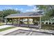 Covered picnic pavilion offers a shaded area to gather with picnic tables near pool and playground at 2265 Huntingdon Dr. # J, Surfside Beach, SC 29575