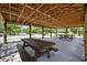 A shaded picnic area featuring wooden tables perfect for outdoor gatherings and enjoying meals in a serene setting at 2265 Huntingdon Dr. # J, Surfside Beach, SC 29575