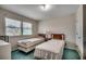 Bright bedroom featuring two beds, window with blinds, and carpet at 2309 Withers Dr. # 5, Myrtle Beach, SC 29577