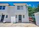 Bright home exterior with a well-manicured yard and decorative black metal front door at 2309 Withers Dr. # 5, Myrtle Beach, SC 29577
