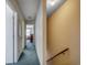 Well-lit hallway with carpet and neutral walls leading to bedrooms at 2309 Withers Dr. # 5, Myrtle Beach, SC 29577